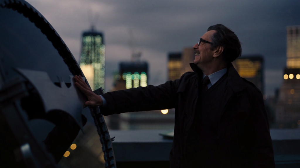 Commissioner Gordon touches the restored Bat-Signal at the conclusion of The Dark Knight Rises (2012)