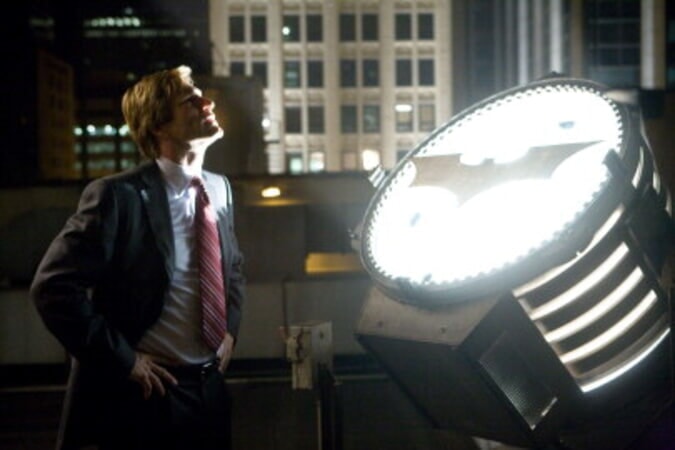 Harvey Dent and the Bat-Signal in The Dark Knight (2008)